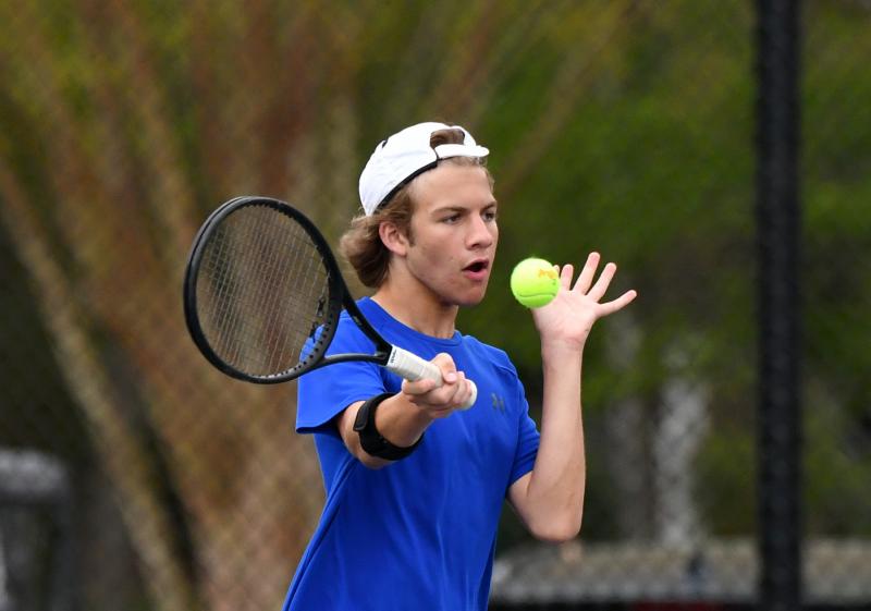 No, he’s not holding the ball. Nick Ables hits a forehand drive for Sussex Central’s first doubles team.