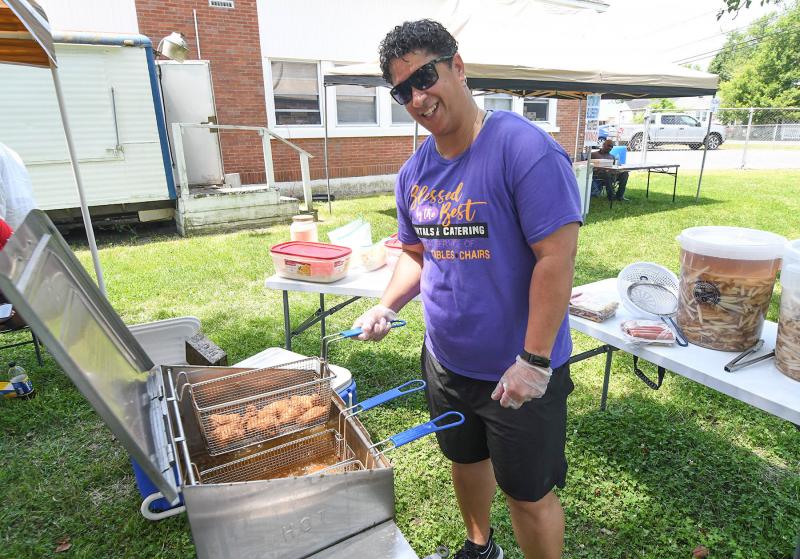 Markishia Wise from Blessed by the Best catering cooks up some tasty chicken, fish and fries.