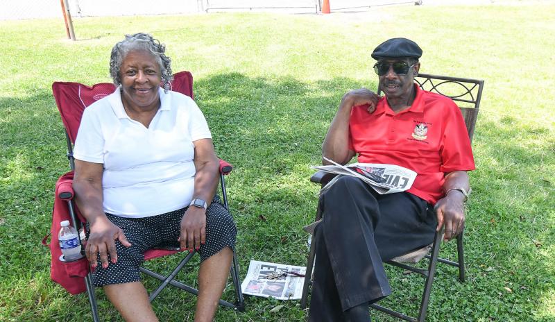Pastor Tambara Stewart, left, of the Restoration Worship Center relaxes with the Rev. John Mizzelle.