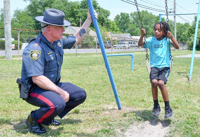 Georgetown Police Chief Ralph Holm reaches out and shares a moment with Karter Jones Akins, 6, during the Sussex County Community Day of Peace and Healing. Karter’s father, Jeffrey L. Akins Jr., was murdered Aug. 8, 2020 in Seaford. DAN COOK PHOTOS