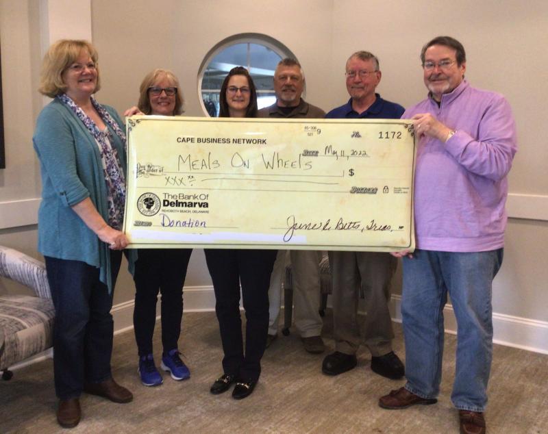 Meals On Wheels Lewes-Rehoboth check presentation attendees shown are Cape Business Network members (l-r) Apryl Parcher, Keller Williams Realty; Debbie Crawford, DC Financial & Consulting Services; Sheila Burek, Henlopen Chiropractic; Fred Brandt, Platinum Choice Bancard; and Roger Anderson, Parcels Plus; with John Wolfle, Meals On Wheels Lewes-Rehoboth. SUBMITTED PHOTO