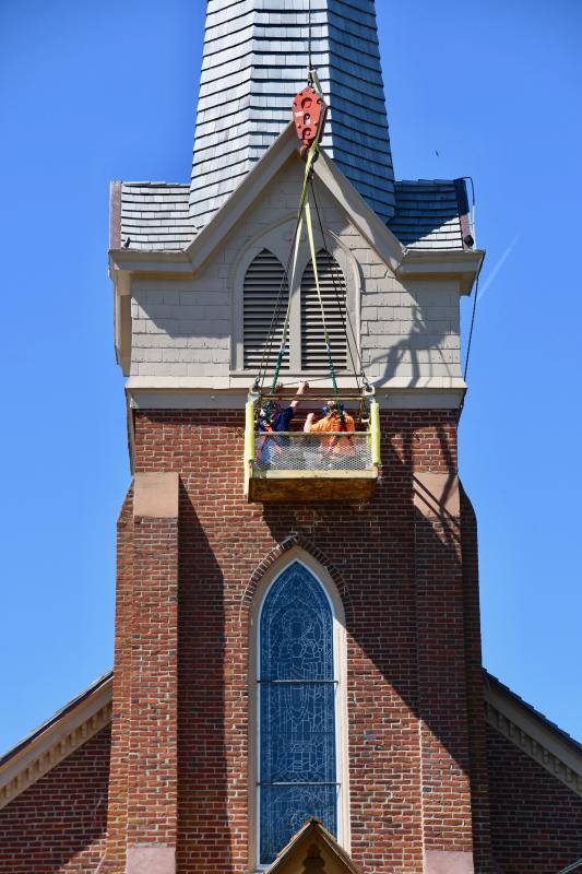 Mike Schimmel and Mike Dolgas of Bella Terra Landscapes and Garden Center work from a lift basket to install new exterior lighting on the steeple at historic St. Peter’s Episcopal Church in downtown Lewes. The company is located on Spicer Road off Route 16 near Ellendale.