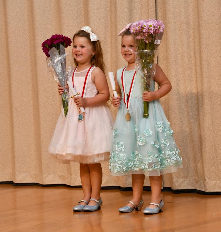 From the Pelican Class, twins Josephine and Juliette Miller pose for a photograph after the program.
