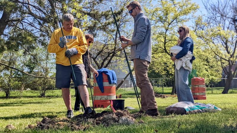 The Bristow family puts the finishing touches on a tree they planted for their 1-month-old daughter, Rose, born just yards away at Beebe Healthcare. Shown are (l-r) Conway Bristow Jr., Annette Bristow, Conway Bristow III, Rose Bristow and Chelsea Bristow.
