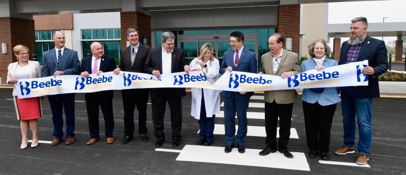 Regina Newell, RN, center, cuts the ribbon to celebrate the May 16 opening of the Specialty Surgical Hospital. She is joined by (l-r) Pamela Baker, board member; Chris Weeks, board member; Tom Protack, Beebe Medical Foundation president; John Hale, MD; Mark Loukides, vice president of facilities; Dr. David Tam, Beebe Healthcare president and CEO; Paul Peet, MD, Beebe Medical Staff president; Sara Larch, board member; and Christian Hudson, Beebe Medical Foundation board chair. RON MACARTHUR PHOTOS