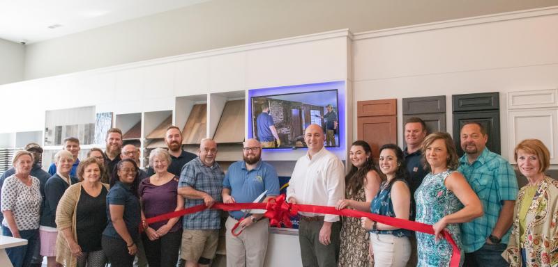 Capstone Homes design studio ribbon-cutting attendees shown are (l-r) Dana Burnett, Alvontae Drummond, Jane Eckrote, Cameron Hayes, Linda Huss, Jordan Truitt, Coulter Truitt, Shannon Bull, Kurt Schneck, Norma Ronkette, Josh Oliphant, Steve Seigel, Mark Williams, Jake Booth, Taylor Dockety, Jessica Garcia, Jimmy Carpenter, Jessica Mattioni, Kyler Woodland and Betsy Reamer, Lewes Chamber of Commerce executive director. SUBMITTED PHOTO