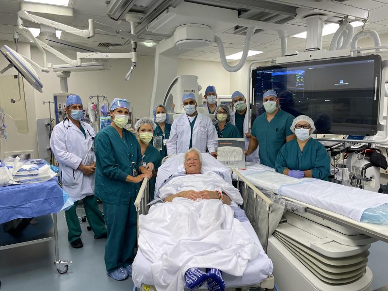 Gathered upon completion of the 100th Watchman heart procedure, Beebe Healthcare’s cardiovascular team members shown are in back (l-r) Dr. George Dahr; Ravin Davidson, cardiac cath tech; Brady Doty, echocardiographer; Dr. Jillian Dashiell; Dr. Ehtasham Qureshi; Dr. Michael Sabadish; Anne Villalobos, CNS; Dr. Mouhanad Freih; Kyle Schlezes, cardiac cath tech; and Tammy Kelly, RN, cardiac cath lead procedural. In front is patient Douglas Welsh. SUBMITTED PHOTO