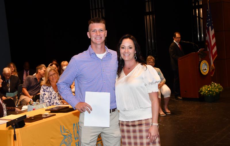 Austin Rhue received the Hood College Founders Scholarship and the Hood College Provost Scholarship & Grant. He is shown with Cape Principal Nikki Miller.