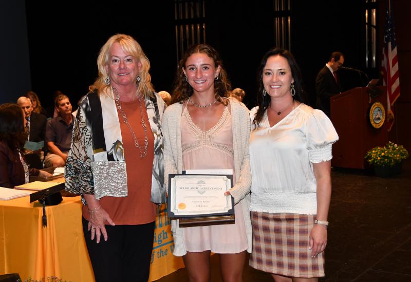 Ella Rishko received the Cape Henlopen High School 2022 Female Athlete of the Year Award, O.W.L. Fund and the President's Award for Educational Excellence. Shown are (l-r) Janet Lawson, Rishko and Cape Principal Nikki Miller.