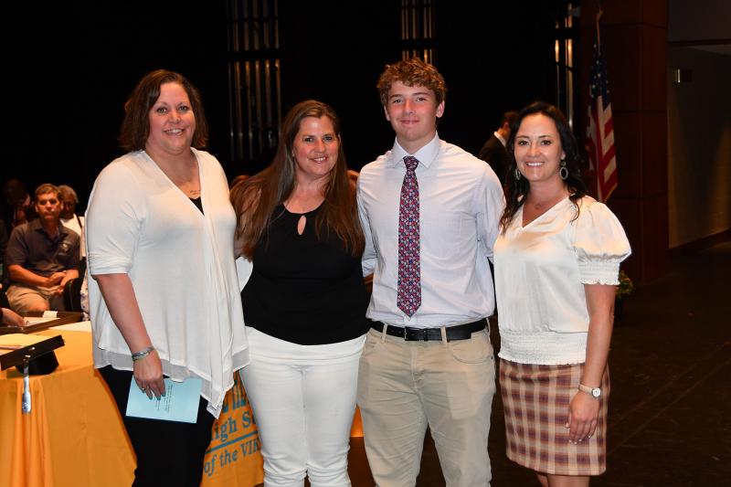 Jack Wiggins received the James J. Kiernan Memorial Scholarship, Lewes Lions Club Ernie Ratledge Scholarship, Milton Lions Foundation Scholarship Award and the President's Award for Educational Excellence. Shown are (l-r) Mary Ellen Kiernan, Kathy Newcomb, Wiggins and Principal Nikki Miller.