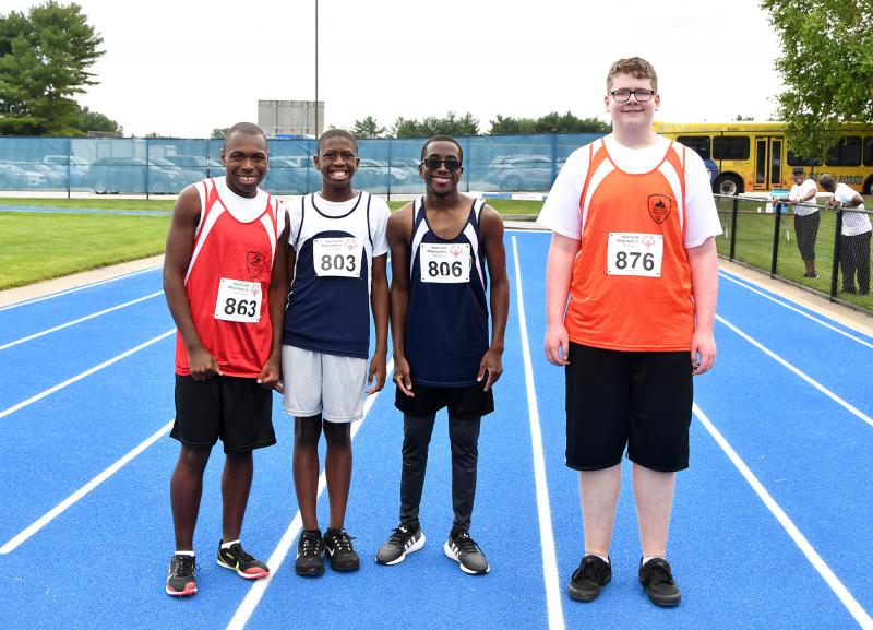 Getting together for a picture after the 100-meter run are (l-r) Deshawn Scye of the Sussex Riptide, Joshua Lewis and Charles Moore of the Kent Wildcats and Alexander Meads of the Wilmington Wizards.