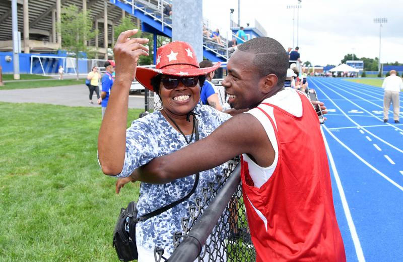 Deshawn Scye of the Sussex Riptide gets a congratulatory hug from his aunt Velda Scye after he won the 100-meter sprint.