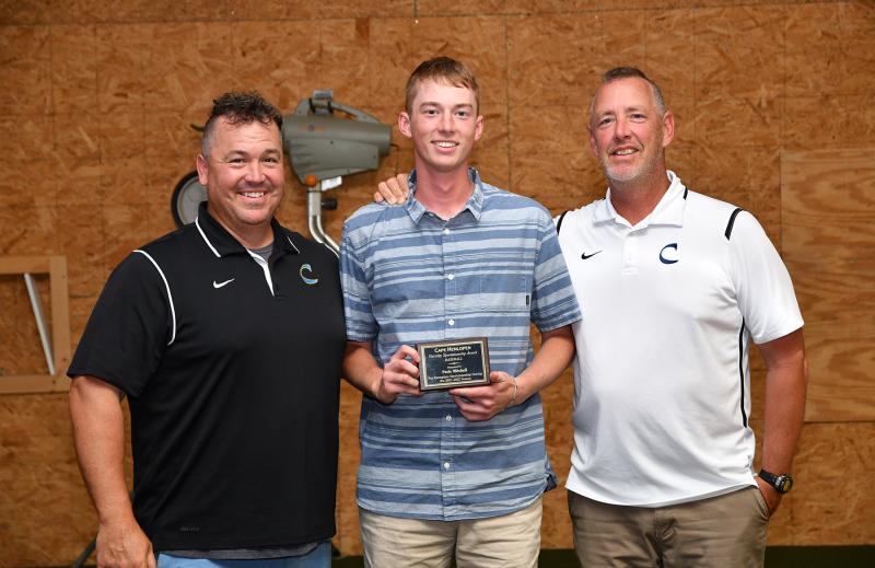 Cape senior Paris Mitchell receives the Sportsmanship Award from head coach Ben Evick, left, and assistant Drew Johnson.