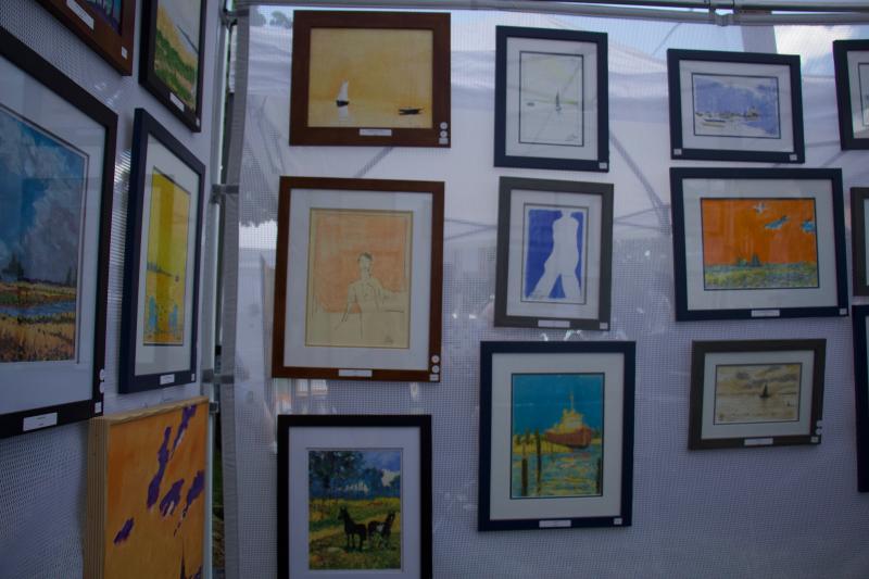 Robert M. Hunter talked about his personal connection to his original works and how a local bartender inspired the orange and yellow silhouette painting.