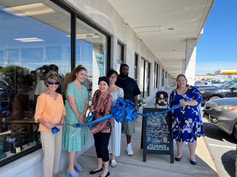 The Rehoboth Beach-Dewey Beach Chamber of Commerce held a ribbon cutting to celebrate Stuart Kingston’s move to Coastal Highway June 10. Shown are (l-r) Carol Everhart, RBDBCC; Kristin Golschinski; Mauria Stein; Angela Berry; Pedro Powell; Kate VanVorst, RBDBCC; and AJ VanVorst in back. SUBMITTED PHOTO