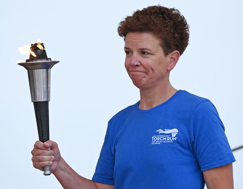 Col. Melissa Zebley, Delaware State Police superintendent, ran the Torch Run leg to the Rehoboth Bandstand before handing the torch over to Rehoboth Beach seasonal police Officer Marie Fuller.