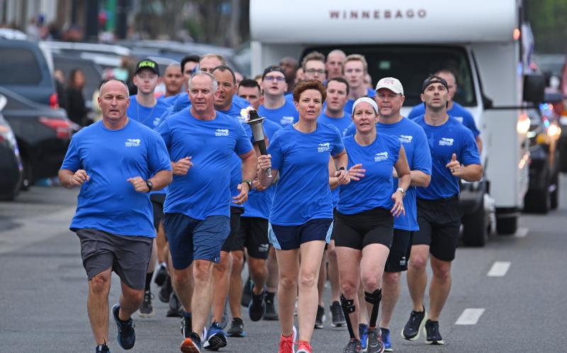 Col. Melissa Zebley, Delaware State Police superintendent, leads a contingent of runners to the Rehoboth Beach Bandstand.