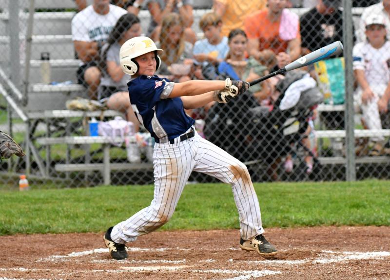 Milton’s Tynan Smith slams a ball to the warning track.