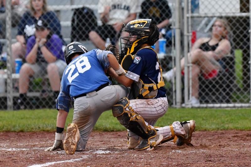 Milton catcher Jordan Williams puts the tag on Lukin Jones at the plate.