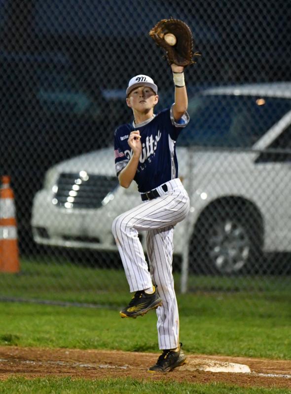Milton’s Trey Dickinson gets a putout at first.