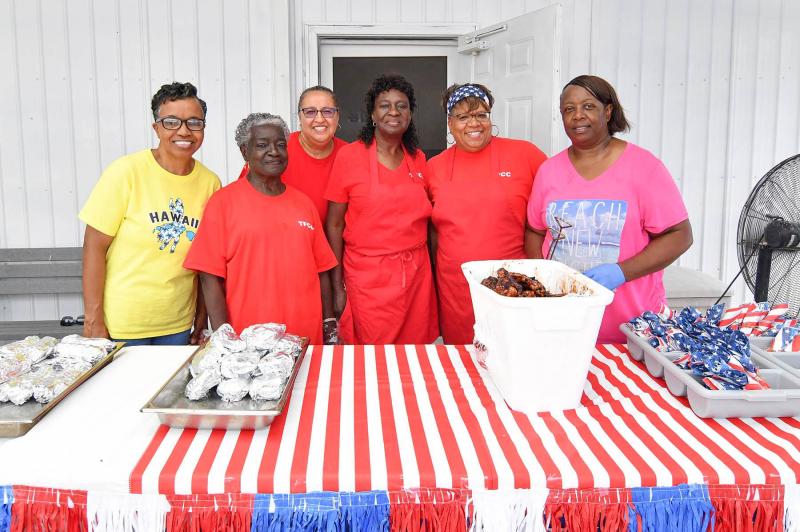 Serving up the free and tasty food are (l-r) Yvonne Kennedy, Joyce Snead, Shelly Street Jones, Barb Murphy, Chantee Harmon and Wescenia Wise.