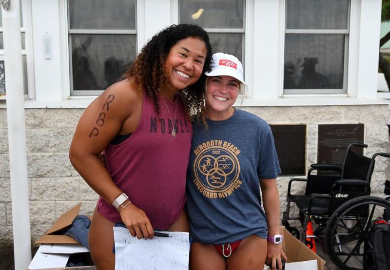 Dion Stevenson, left, and Alicia Lenoir of Rehoboth Beach Patrol handle check-ins at the RBP shack. Lenior took top honors in the mile run competition.