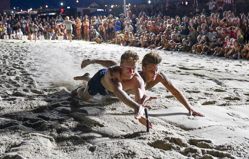 Bethany Beach Patrol’s Brenden Keane beats Dewey Beach Patrol’s Eid Nouhra to win the beach flags competition.