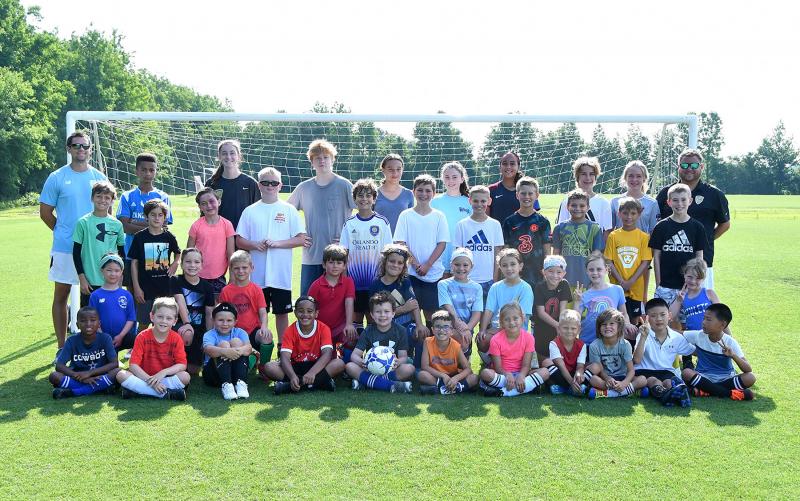 Nearly 40 promising players took part in the Henlopen Soccer Club summer camp. Shown are in back are (l-r) coach Joe Rupar,
Kihara Ngido, coach Sara Kilby, Christian Bjorklund Neelan, coach Gabby Hamstead, coach Ellie Girth, Ni’si Ngido, Charlie Slater, Abby Slater and Camp Director Patrick Kilby. In third row are Gavin Clark, Liam Gonzon, Stella Hastings, Cam Kilby, Cohen Meredith, Tyler Wojcik, Eli Evans, Justin DiCandido, Blake Jarecki, Austin Brobyn and Jacoby Gallagher; second row Leila Shenkle, Jace Wojcik, Grant Hudson, Ned Kambouchev, Enzo Felix, Addison Farrell, Charlotte Brooks, Ellie Stretch, Madeline Zaciek and Ainsley Schneider. In front are Eliaz Gardner, Ryan Mariani, Ike O’brien, Kaleb Dale-Stevenson, Cameron Kennedy, Kowen West, Gabby DiCandido, William Szeman, Declan Stretch, Lucas Yiiap and Maxamillian Shi. DAN COOK PHOTOS