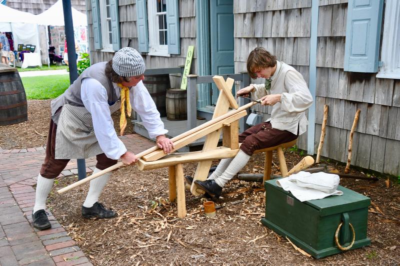 Lewes Historical Society reenactors Bill Hicks, left, and University of Delaware intern Dawson Gehrke work to complete a handmade boat hook during a demonstration of Colonial workmanship.