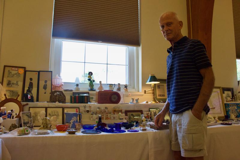 Bill Hicks of Rehoboth Beach showcases his inventory of goodies, including a classic 1940 FADA radio.