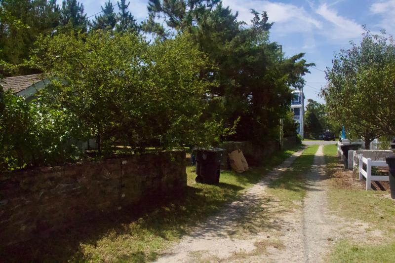 A back alley grants access to a driveway on the 12 Kentucky Ave. property. When traveling west, the entrance is an abrupt left, and pulling in can require multiple turns.