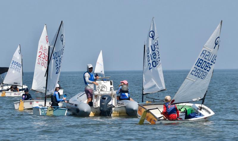 Severn Sailing Association youth competitors gather around their coach before the start of the regatta.
