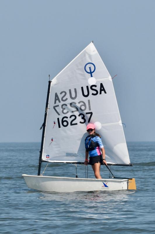 Severn Sailing Association sailor Sofia Cole takes a short break after finishing a race in the Optimist blue fleet.