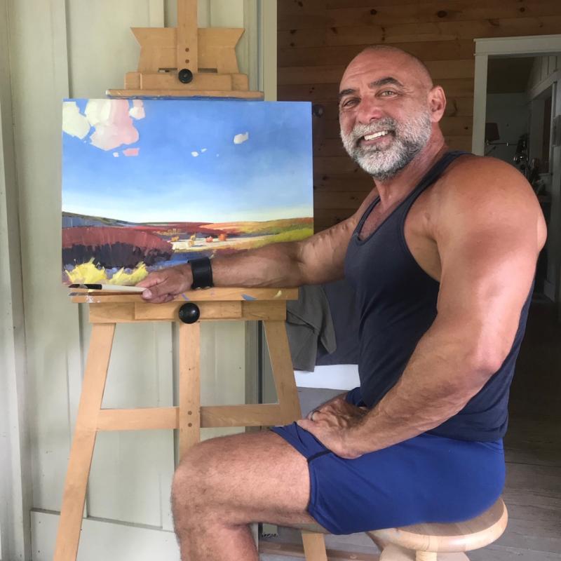 Delaware painter Andrew Criss, shown at his Rehoboth studio, will host an outdoor art show Aug. 20. SUBMITTED PHOTO