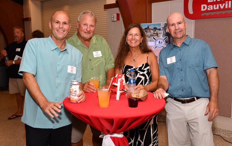 Sharing a picture are (l-r) Jason McKay (1992-99), Ronnie Allen (1968-93), Staci Coveleski and Pete Coveleski (1978-86).