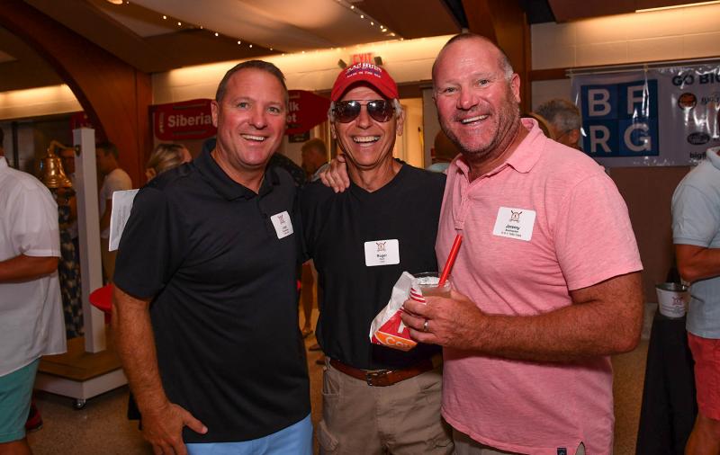 Sharing a laugh are (l-r) Josh Bushweller (1990-94), Roger Hunt (1978) and Jeremy Bushweller (1990-94).