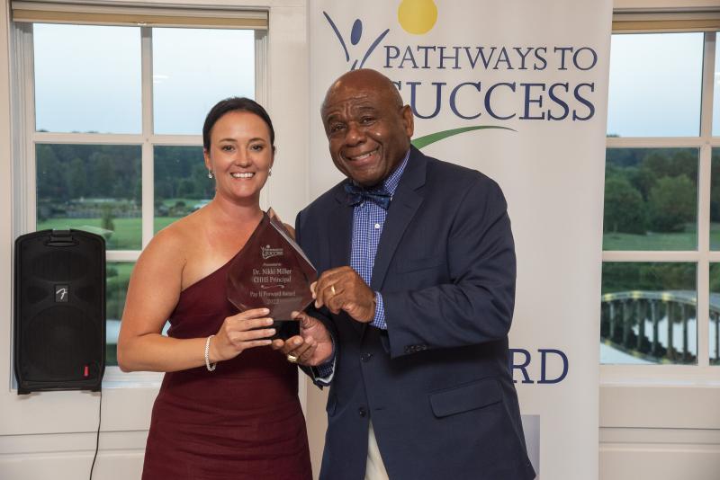 In July, Nikki Miller received the Pathways to Success Pay it Forward Award presented by Bill Collick in recognition of her dedication and leadership. DENY HOWETH PHOTO