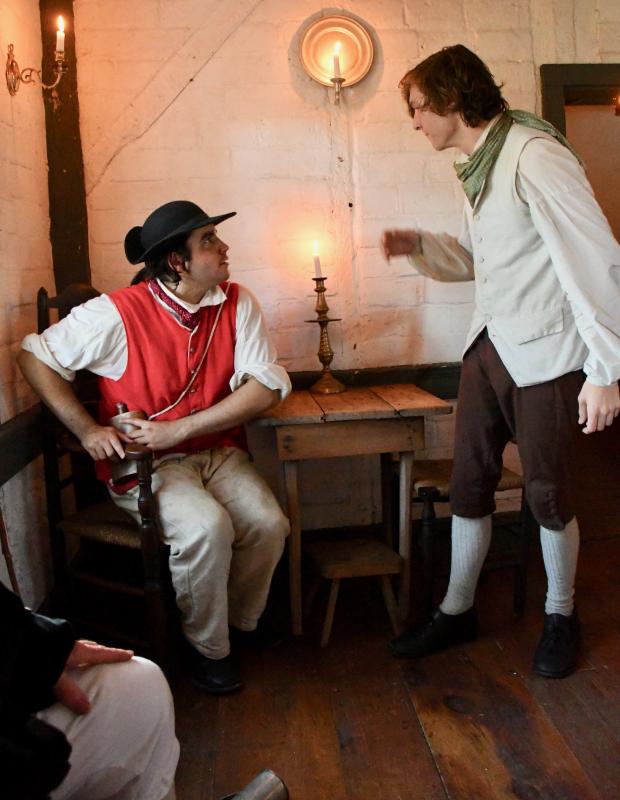 Griffin Barrow, as Henry Fisher, left, and Dawson Gehrke, as Capt. Gamble, nearly come to blows in the first scene. Confrontations between Loyalists and Patriots were commonplace in the 1770s.