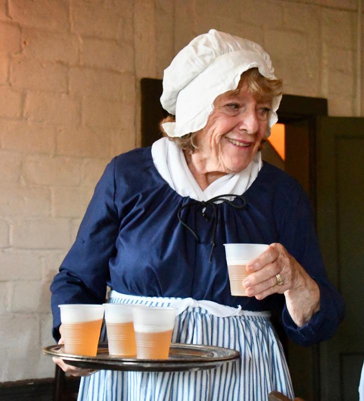 Ina Appolite serves beer to those attending the Aug. 6 Tavern Talk. A beer pairing was offered before the start of each of the seven scenes presented by The Sussex Tavern Players.