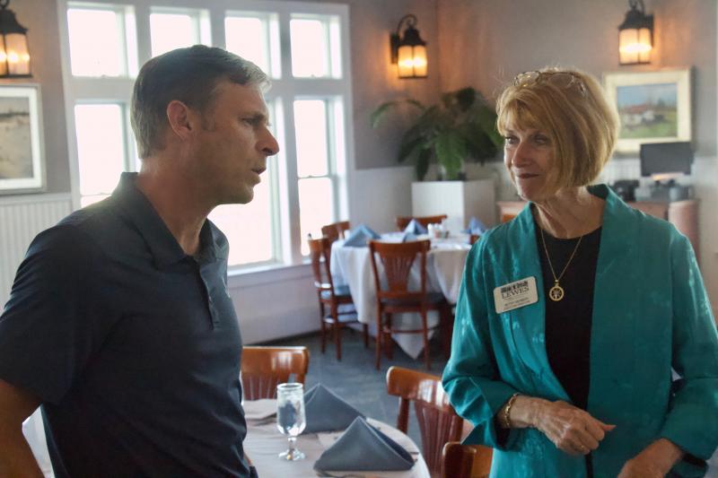 Lewes Mayor Andrew Williams talks to Lewes Chamber of Commerce Executive Director Betsy Reamer shortly before the festivities get underway.