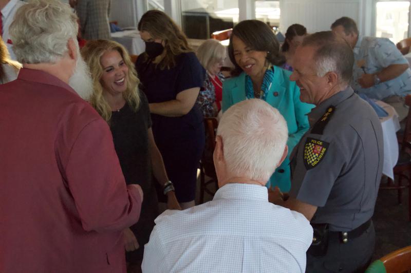 Sharing a laugh are (l-r) Paul Evalds, Ellen Spell, Congresswoman Lisa Blunt Rochester, Joe Reamer and Lewes Police Chief Thomas Spell.