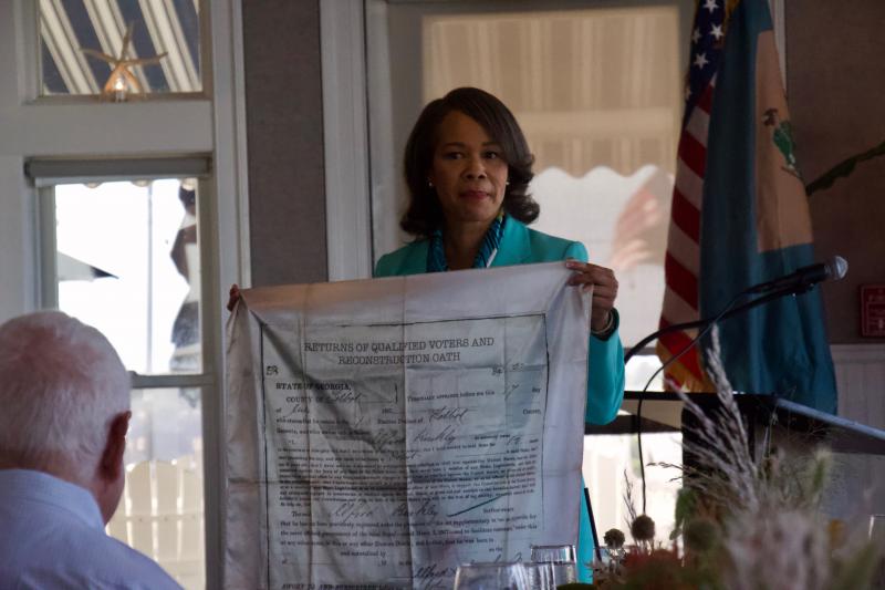 Becoming the first woman and the first African American to represent Delaware in Congress, Rep. Lisa Blunt Rochester explains why she chose to wear the fabric of the voter card of her formerly enslaved great-great-great grandfather when she was sworn in for the first time.