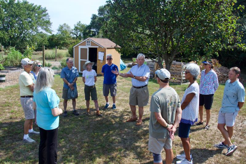 Former Mayor Ted Becker explains the planning that had to be done for the Lewes Community Garden in Great Marsh Park. 2022 marks the garden’s fourth season. Shown are (l-r) LCG member Lou Papp, Judith Edwards, LCG co-founder Cathy Harris, LCG member Patrick Gaffney, LCG member Perrin Smith, Councilman Tim Ritzert, former Mayor Ted Becker, LCG co-founder Michael Whitehouse, Parks and Rec Commissioner Judi Jeffers, LCG member Barbee Kiker and Mayor Andrew Williams