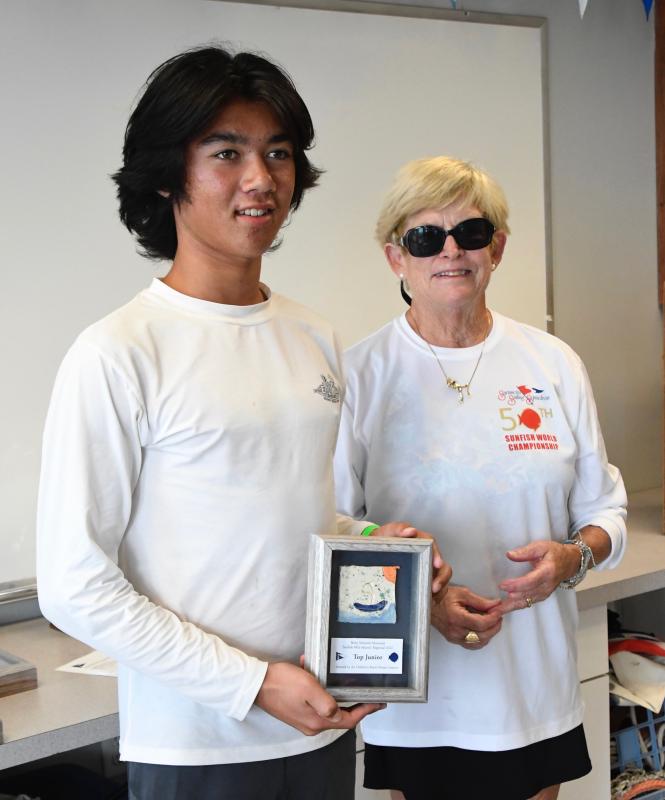 LYC sailor William Merritt is presented with the Top Junior Sunfish Sailor Award by organizer Connie Miller.