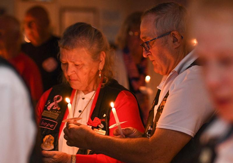 Chaplain Marian Willman and her husband Walt hold candles in remembrance of the victims of the 9/11 attacks.