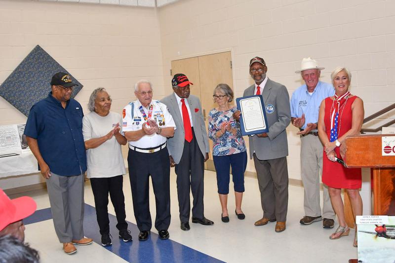 Receiving the Senate proclamation are (l-r) Brig. Gen. Ernest Talbert; Peggy Swygert of the Tuskegee Airman Porter Group; Walt Koopman; John Dumas of the Tuskegee Airman; Joanne Coons, treasurer of the Porter Group; Dr. Don Blakey, president of the Porter Group; Sen. Dave Wilson, R-Lincoln; and Rep. Ruth Briggs King, R-Georgetown.