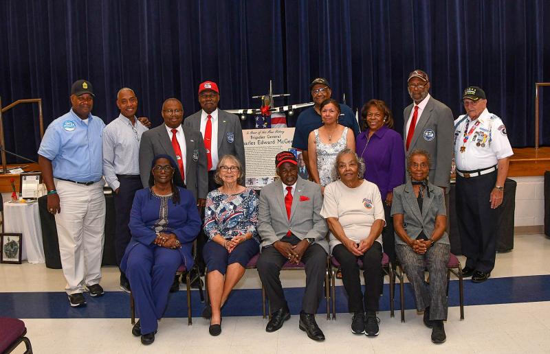 Honoring Tuskegee Airman Brig. Gen. Charles Edward McGee are in back (l-r) Greg Fuller, Fred Armstrong, William Franklin, James Lewis, Brig. Gen. Ernest G. Talbert, Richelle Talbert, Dr. Wilma Mishoe, Don Blakey and Walt Koopman. In front are Dee Blake, Joanne Coons, John Dumas, Peggy Swygert and Delores Blakey. DAN COOK PHOTOS