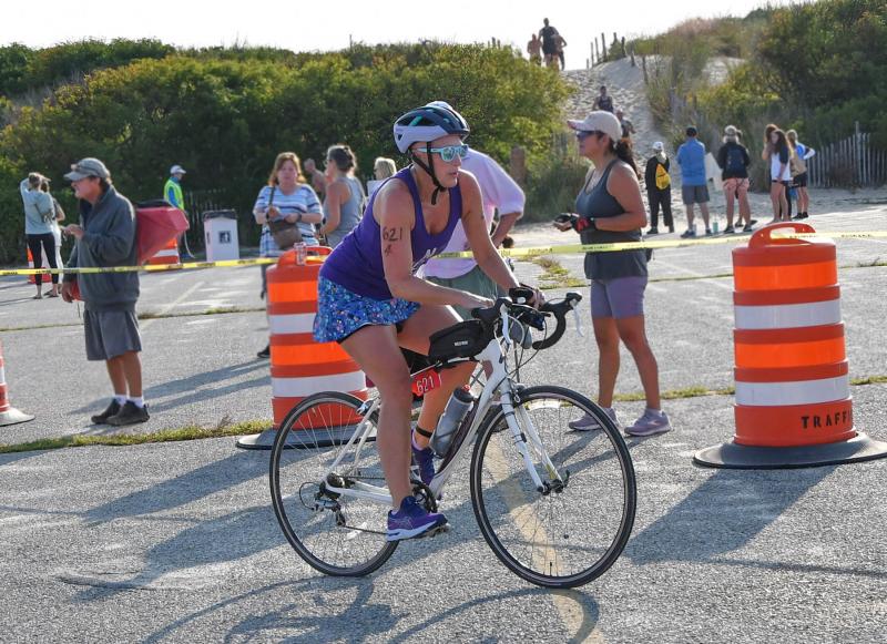 Alison Andrew takes off from the transition area. She participated in the duathlon, which included a half-mile beach run, 15.5-mile bike ride and a 3.3-mile run. She finished with a time of 2:27:48. Andrew is battling Stage 4 Hodgkins Lymphoma and returns to chemo Sept. 19.