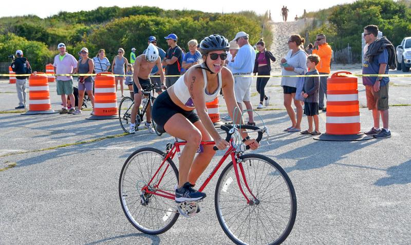 Liz Wist of Berlin, Md. takes off for the bike leg. She placed fourth in the female 30-34 age group.