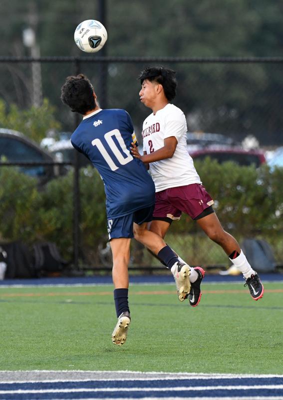 Seahawks player Alexander Jaimes collides on a 50/50 header with Milford’s Yoiner Velasquez Moralez.